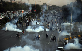 Pakistani security forces respond to protesters with tear gas as thousands of supporters of Pakistan's former Prime Minister Imran Khan took to the streets to protest against his disqualification by the election authority in Islamabad, Pakistan on October 21, 2022.