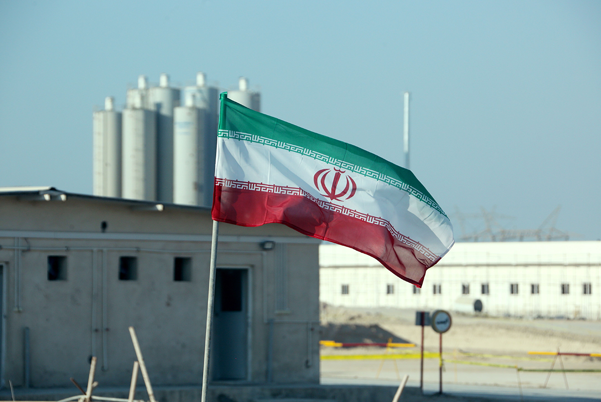 Photo above: A picture taken on November 10, 2019 shows an Iranian flag in Iran’s Bushehr nuclear power plant, during an official ceremony to kick-start works on a second reactor at the facility. Photo by ATTA KENARE/AFP via Getty Images.